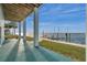 Covered patio overlooking the water with private dock access at 6423 Driftwood Dr, Hudson, FL 34667
