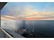 Stunning sunset over calm water; private dock with boat lift at 6423 Driftwood Dr, Hudson, FL 34667