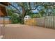 Large backyard with deck and mature oak tree at 700 S Prospect Ave, Clearwater, FL 33756