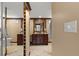Elegant bathroom with granite vanity, tile shower, and mirrored storage at 700 S Prospect Ave, Clearwater, FL 33756