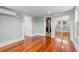 Hardwood floor bedroom with mirrored closet and access to bathroom and another room at 700 S Prospect Ave, Clearwater, FL 33756