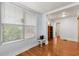 Hardwood floor bedroom with window and bookshelf at 700 S Prospect Ave, Clearwater, FL 33756