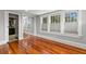 Bedroom with hardwood floors, mirrored closet, and ensuite bathroom at 700 S Prospect Ave, Clearwater, FL 33756