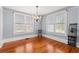 Bright dining room featuring hardwood floors and a crystal chandelier at 700 S Prospect Ave, Clearwater, FL 33756