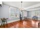 Spacious dining room with hardwood floors, chandelier, and built-in shelving at 700 S Prospect Ave, Clearwater, FL 33756