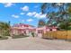 Backyard view of pink house with guest house at 700 S Prospect Ave, Clearwater, FL 33756