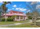 Pink house with landscaping and palm trees at 700 S Prospect Ave, Clearwater, FL 33756