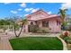 Pink house with a landscaped yard and detached structure at 700 S Prospect Ave, Clearwater, FL 33756