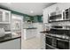 Well-equipped kitchen featuring stainless steel appliances and granite countertops at 700 S Prospect Ave, Clearwater, FL 33756
