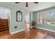 Sunroom with wood floors and view to backyard at 700 S Prospect Ave, Clearwater, FL 33756