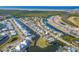 Wide aerial showcasing waterfront home and community at 710 Islebay Dr, Apollo Beach, FL 33572