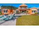 Relaxing backyard with patio, pool and lush landscaping at 710 Islebay Dr, Apollo Beach, FL 33572