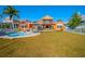Large backyard with pool and spacious patio area at 710 Islebay Dr, Apollo Beach, FL 33572