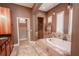 Elegant bathroom with soaking tub and walk-in shower at 710 Islebay Dr, Apollo Beach, FL 33572