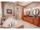 Spa-like bathroom with soaking tub and double vanity at 710 Islebay Dr, Apollo Beach, FL 33572