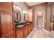 Double vanity bathroom with granite countertops at 710 Islebay Dr, Apollo Beach, FL 33572