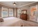 Primary bedroom features a dresser and private access to patio at 710 Islebay Dr, Apollo Beach, FL 33572