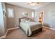 Cozy bedroom with carpet and access to a bathroom at 710 Islebay Dr, Apollo Beach, FL 33572
