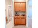 Wooden storage cabinet with shelving and drawers at 710 Islebay Dr, Apollo Beach, FL 33572