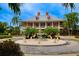 Community clubhouse with fountain, palm trees, and a grand entrance at 710 Islebay Dr, Apollo Beach, FL 33572