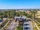Gated community entrance with palm trees and landscaping at 710 Islebay Dr, Apollo Beach, FL 33572