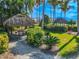 Quaint thatched gazebo with picnic table in a tropical setting at 710 Islebay Dr, Apollo Beach, FL 33572