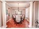 Formal dining room featuring hardwood floors and classic columns at 710 Islebay Dr, Apollo Beach, FL 33572