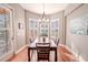 Sunlit dining area with table and chairs, near sliding doors at 710 Islebay Dr, Apollo Beach, FL 33572