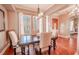 Bright dining room with hardwood floors and elegant chandelier at 710 Islebay Dr, Apollo Beach, FL 33572