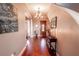 Bright entryway with hardwood floors and elegant light fixture at 710 Islebay Dr, Apollo Beach, FL 33572