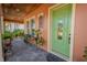Front entrance with light green door and decorative plants at 710 Islebay Dr, Apollo Beach, FL 33572
