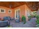 Relaxing covered patio with seating area and wood ceiling at 710 Islebay Dr, Apollo Beach, FL 33572