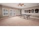 Game room with ping pong table and french doors at 710 Islebay Dr, Apollo Beach, FL 33572