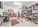 Garage workshop with storage and bikes at 710 Islebay Dr, Apollo Beach, FL 33572