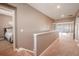 Upstairs hallway with access to bedrooms and game room at 710 Islebay Dr, Apollo Beach, FL 33572