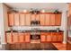 Updated kitchen with wood cabinets and granite countertops at 710 Islebay Dr, Apollo Beach, FL 33572