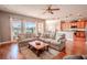 Open living room with kitchen views and hardwood floors at 710 Islebay Dr, Apollo Beach, FL 33572