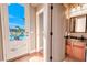 View of the pool from a bathroom with access door at 710 Islebay Dr, Apollo Beach, FL 33572