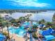 Aerial view of resort pool, lighthouse, and surrounding community at 710 Islebay Dr, Apollo Beach, FL 33572
