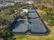 Community tennis courts with surrounding trees and greenery at 710 Islebay Dr, Apollo Beach, FL 33572