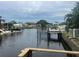 Waterfront property with private dock and boat lift, offering serene canal views at 8540 Riverside, St Petersburg, FL 33702