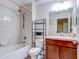 Clean bathroom with a shower/tub combo and wood vanity at 11902 Greengate Dr, Hudson, FL 34669