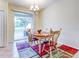 Dining room with an oval table, chairs and access to a patio at 11902 Greengate Dr, Hudson, FL 34669