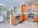 Kitchen with stainless steel appliances and wood cabinets at 11902 Greengate Dr, Hudson, FL 34669
