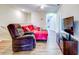 Relaxing living room with leather recliner and red couch at 11902 Greengate Dr, Hudson, FL 34669