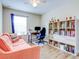 Home office with a comfortable couch and built-in shelving at 11902 Greengate Dr, Hudson, FL 34669