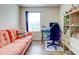 Bright home office featuring a desk, comfortable couch, and shelving at 11902 Greengate Dr, Hudson, FL 34669
