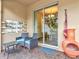 Relaxing patio with wicker chairs, a fire pit, and a vertical garden at 11902 Greengate Dr, Hudson, FL 34669