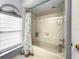 Clean bathroom with shower/tub combo and updated fixtures at 10454 Ventura Dr, Spring Hill, FL 34608