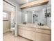 Double vanity bathroom with a large mirror and shower at 10454 Ventura Dr, Spring Hill, FL 34608